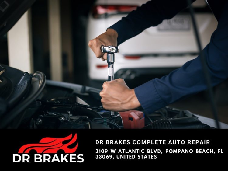 Skilled technicians diagnosing and maintaining a vehicle for optimal performance and safety.